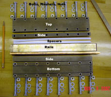 All parts of the Rail Stack/enclosure laid out on a table.